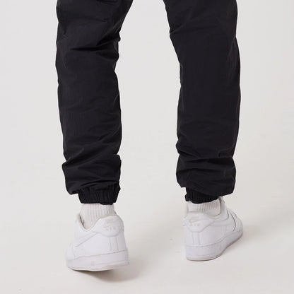 The model is wearing this MLB Piping New York Yankees Track Pants in navy. 7