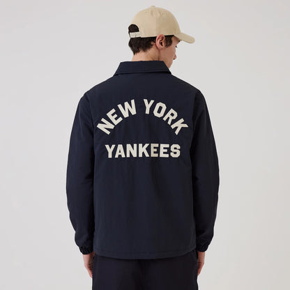 The model is wearing this MLB New York Yankees Coach Jacket in navy. 2
