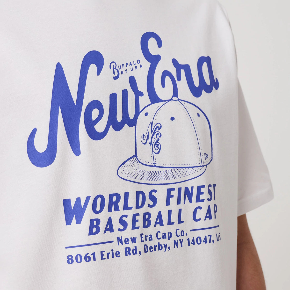 The model is wearing this New Era Heritage Oversized T-Shirt in white. 5