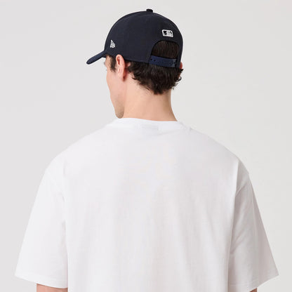 The model is wearing this New Era Heritage Oversized T-Shirt in white. 8