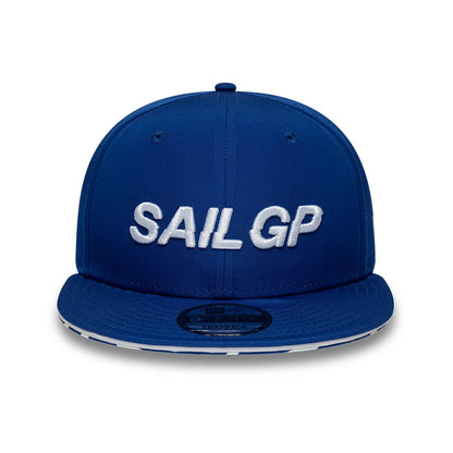 Sail GP Limited Blue New Era 9FIFTY Snapback Adjustable Cap, front view showing white embroidered SAIL GP lettering on the structured blue crown, a flat blue visor with a 9FIFTY size sticker, and two eyelets on each side.
