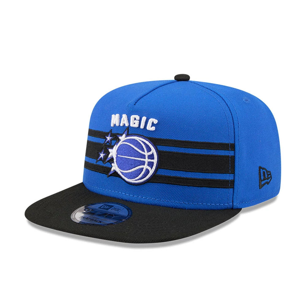 Orlando Magic NBA Tip Off 2026 Blue New Era 9FIFTY A-Frame Snapback Adjustable Cap, front view showing the white and blue Magic logo with stars in raised embroidery on the blue structured crown, a black flat visor, and 9FIFTY size sticker.