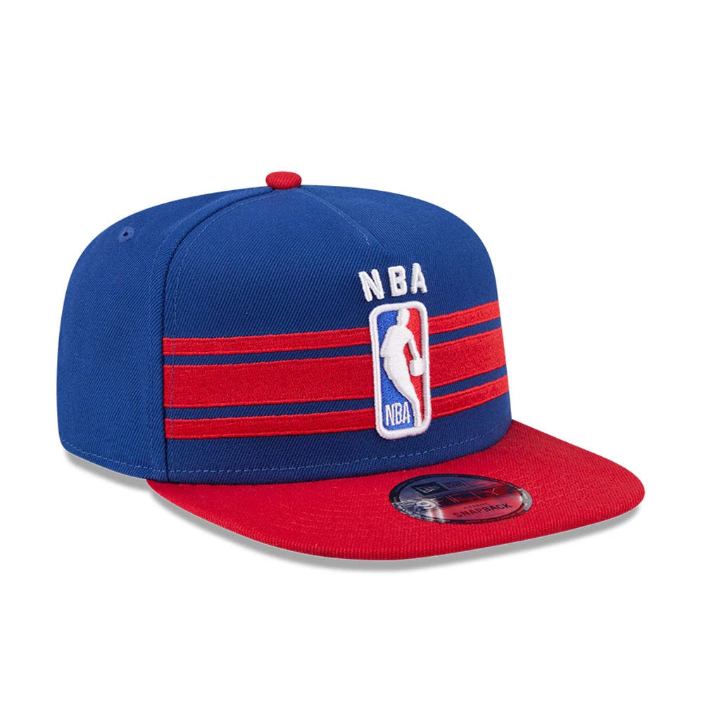 NBA Logo NBA Tip Off 2026 Blue New Era 9FIFTY A-Frame Snapback Adjustable Cap, front view showing the white and red embroidered NBA logo on the structured blue crown, with a flat red visor and 9FIFTY size sticker.