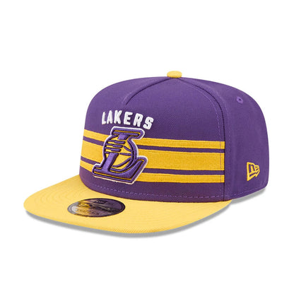 LA Lakers NBA Tip Off 2026 Purple New Era 9FIFTY A-Frame Snapback Adjustable Cap, front view showing the raised embroidered Lakers logo in yellow and white on purple, with matching stripes across the front panel and a contrasting yellow flat visor.