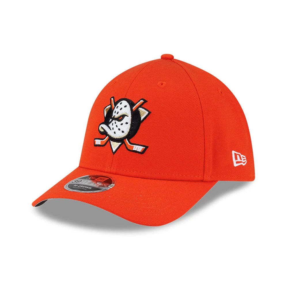 Anaheim Ducks NHL Team Orange New Era 39THIRTY M-Crown Stretch Fit Cap, three-quarter view showing the raised embroidered hockey mask logo on the orange front panel, curved visor with a 39THIRTY size sticker, and New Era flag logo on the left side.