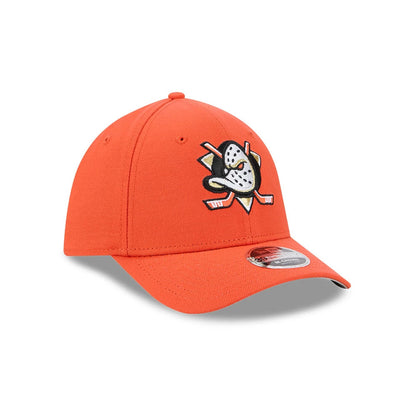 Anaheim Ducks NHL Team Orange New Era 39THIRTY M-Crown Stretch Fit Cap, three-quarter view showing the flat embroidered Anaheim Ducks logo on the front panel, with a curved orange visor and a 39THIRTY size sticker on the visor.