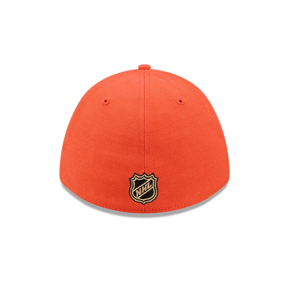 Anaheim Ducks NHL Team Orange New Era 39THIRTY M-Crown Stretch Fit Cap, rear view showing the black and gold embroidered NHL shield logo centred on the back panels, with an orange crown featuring two small embroidered eyelets.