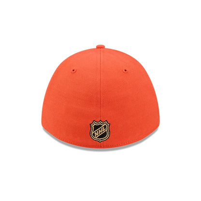 Anaheim Ducks NHL Team Orange New Era 39THIRTY M-Crown Stretch Fit Cap, rear view showing the black and gold embroidered NHL shield logo centred on the back panels, with an orange crown featuring two small embroidered eyelets.