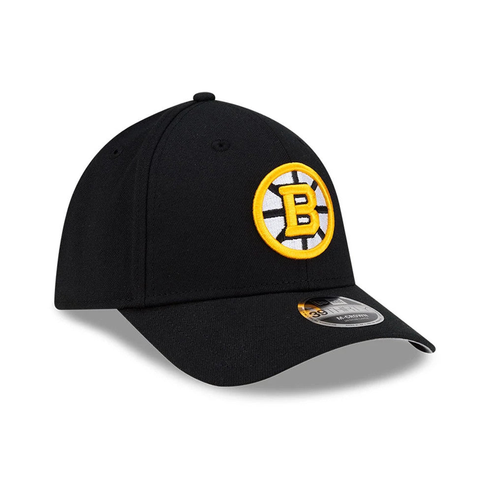 Boston Bruins NHL Team Black New Era 39THIRTY M-Crown Stretch Fit Cap, front view showing a yellow and white embroidered Bruins logo on the front panel, with a curved black visor and a 39THIRTY size sticker on the top.