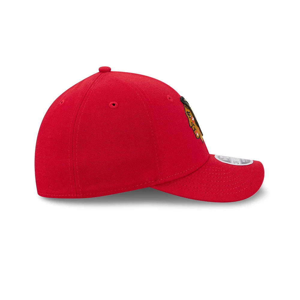 Chicago Blackhawks NHL Team Red New Era 39THIRTY M-Crown Stretch Fit Cap, side view showing the detailed embroidered Blackhawks logo on the front panel, the curved red visor, and the classic 39THIRTY size sticker on the visor.
