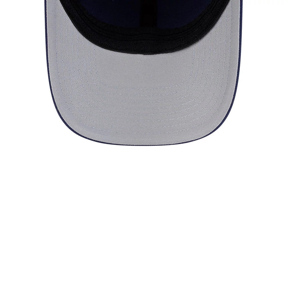 Montreal Canadiens NHL Team Navy New Era 39THIRTY M-Crown Stretch Fit Cap, inside view showing a grey undervisor, a navy blue sweatband lining, and black seam taping along the curved inner edge of the visor.