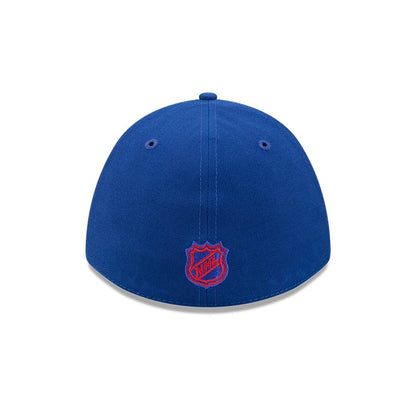New York Rangers NHL Team Blue New Era 39THIRTY M-Crown Stretch Fit Cap, rear view showing the red embroidered NHL logo shield at the centre of the back panels, with blue eyelets and a matching top button on the structured blue crown.