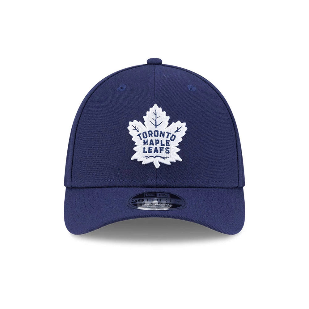 Toronto Maple Leafs NHL Team Navy New Era 39THIRTY M-Crown Stretch Fit Cap, front view showing a white embroidered leaf logo on the navy front panels, navy curved visor with a 39THIRTY size sticker, and matching top button.