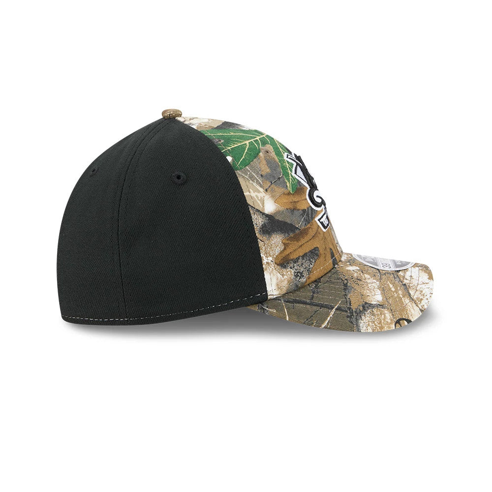 Anaheim Ducks NHL Realtree Camo New Era 39THIRTY M-Crown Stretch Fit Cap, side view showing the distinctive black back panel with two embroidered eyelets, camo pattern covering the front and visor, and the white embroidered logo on the front panel.