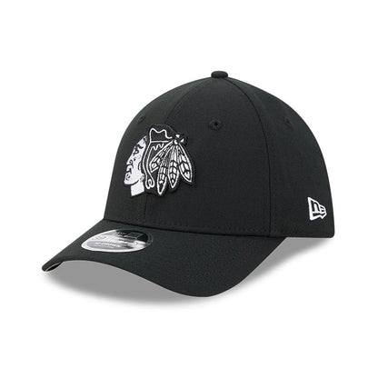 Chicago Blackhawks NHL Black New Era 39THIRTY M-Crown Stretch Fit Cap, three-quarter view showing the raised white and black embroidered Blackhawks logo on the front panel, black curved visor with a 39THIRTY size sticker.