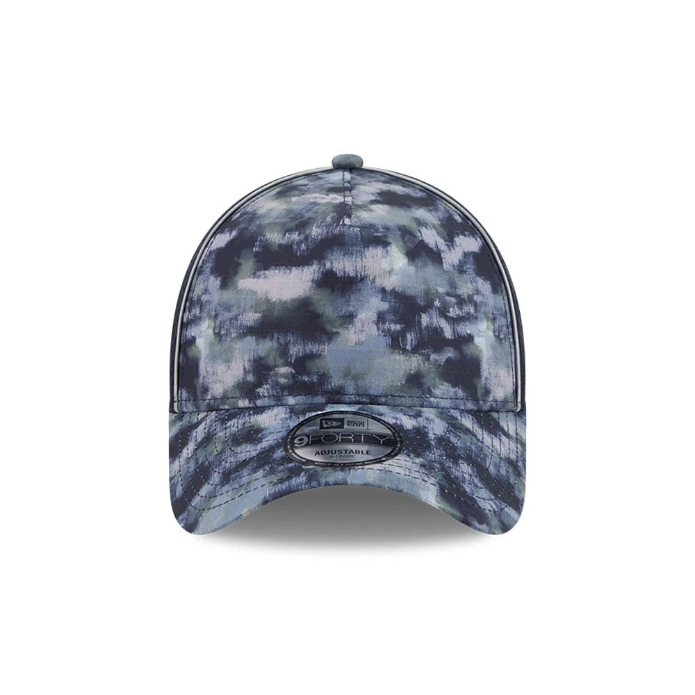 New Era Elevated Basics Navy New Era 9FORTY A-Frame Adjustable Cap, front view showing an abstract navy and grey pattern covering the structured crown, a curved visor, and the 9FORTY size sticker centred on the visor.