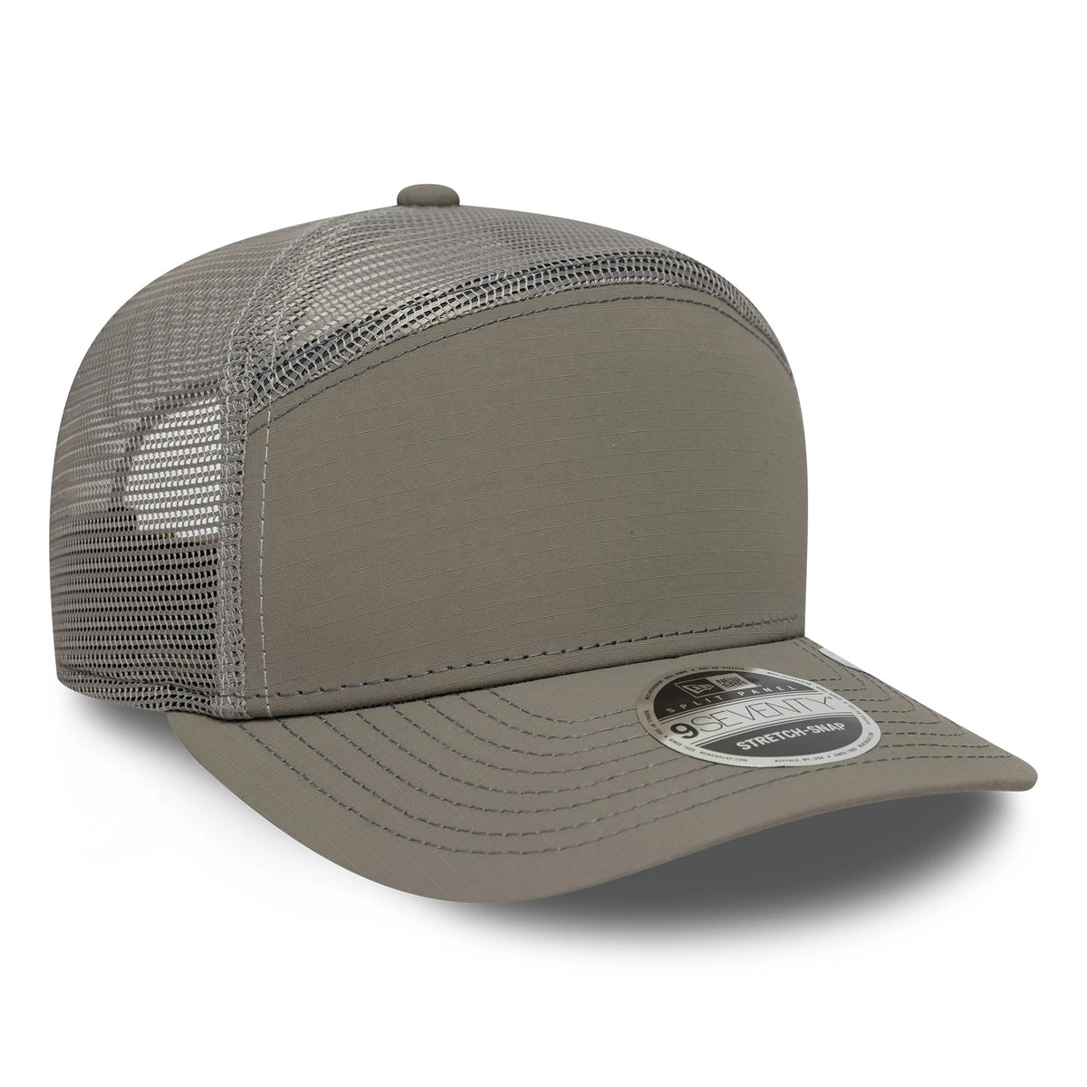New Era Elevated Basics Open Grey 9SEVENTY Split Panel Stretch Snap Cap, three-quarter view showing the silver mesh back panels, flat grey front panel, and a 9SEVENTY size sticker on the matching grey curved visor.