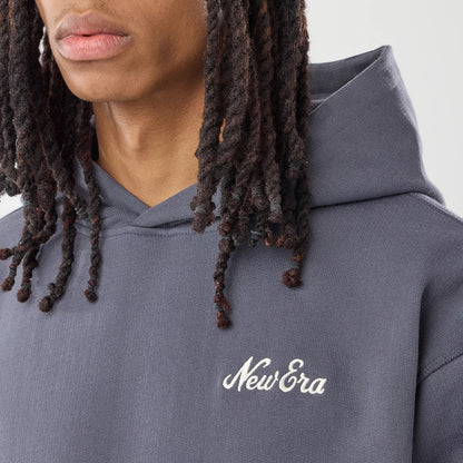 The model is wearing this New Era Open Hem Pullover Hoodie in grey. 4