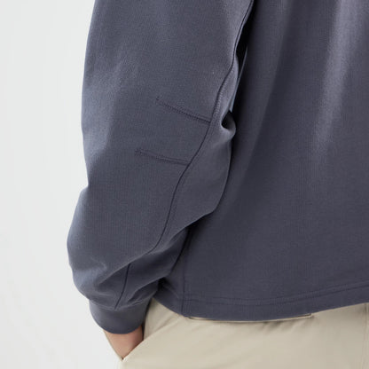 The model is wearing this New Era Open Hem Oversized Crew Neck Sweater in dark grey. 5