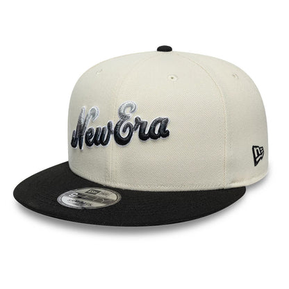 New Era Ombre Script Light Beige & Black New Era 9FIFTY Snapback Adjustable Cap, front view showing raised black and grey embroidered New Era script on the light beige front panel, a black flat visor with a 9FIFTY size sticker.