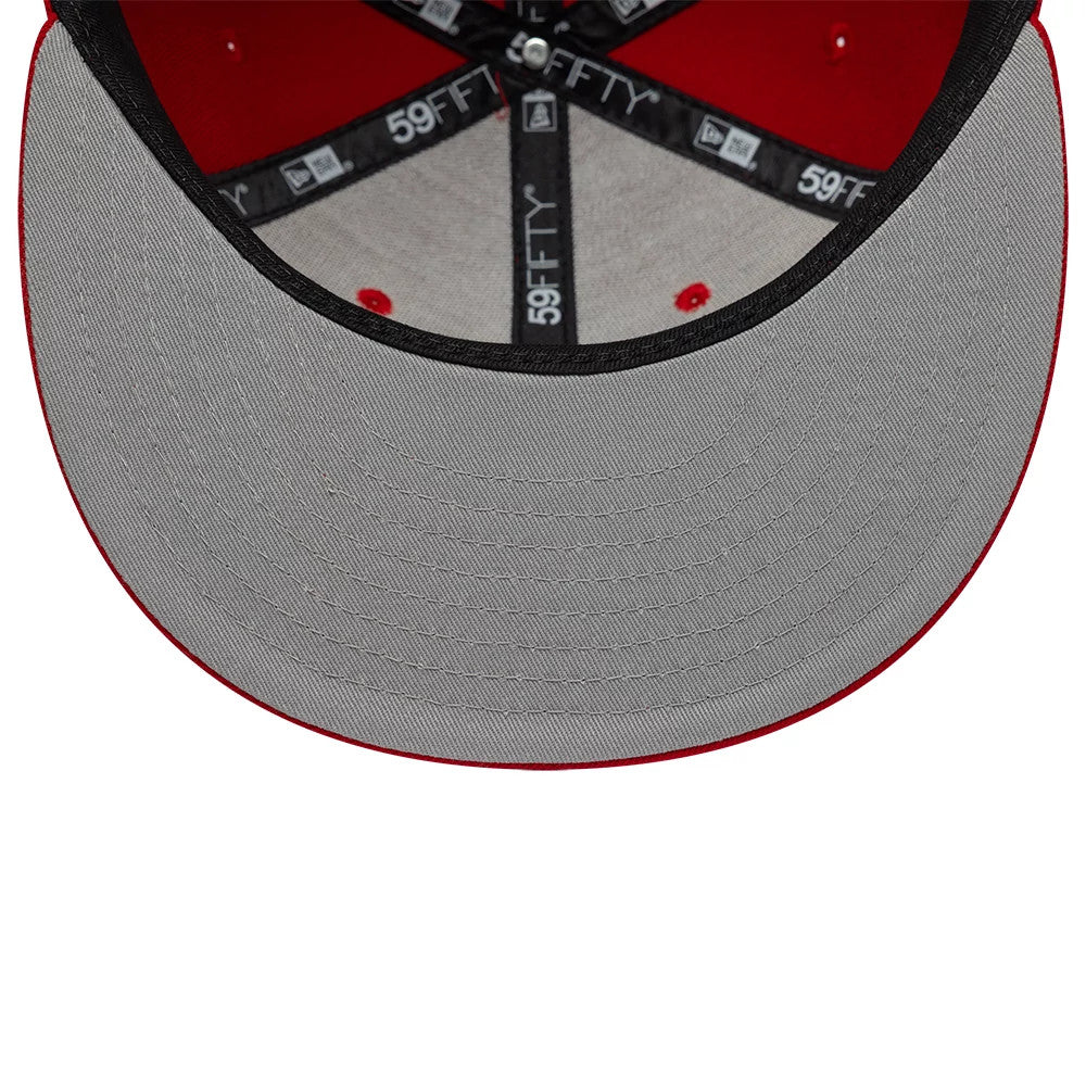 Gettomasa X New Era Red 59FIFTY Fitted Cap, inside view showing the grey undervisor with precise stitching, black 59FIFTY-branded taping along the seams, and red colour accents at the stitching points against the cap's red interior.