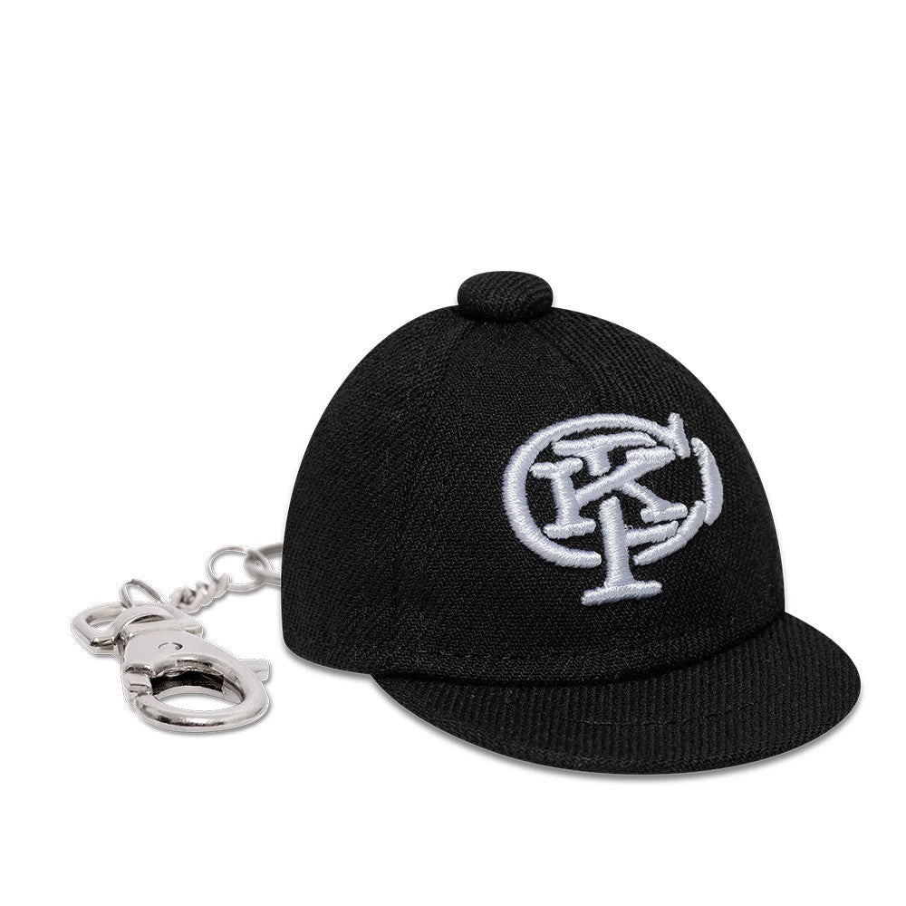 Gettomasa X New Era Black Key Chain, front view showing a mini black cap design with a raised white embroidered emblem on the front panel, attached to a silver keyring with a clip and chain.