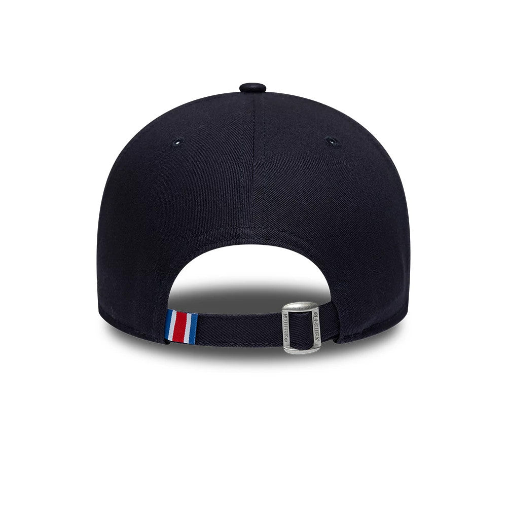 Paris Saint-Germain Core Navy New Era 9FORTY Adjustable Cap, rear view showing a tricolour strap with blue, white, and red stripes and a silver adjustable buckle, beneath the structured navy crown with matching embroidered eyelets on the panels.