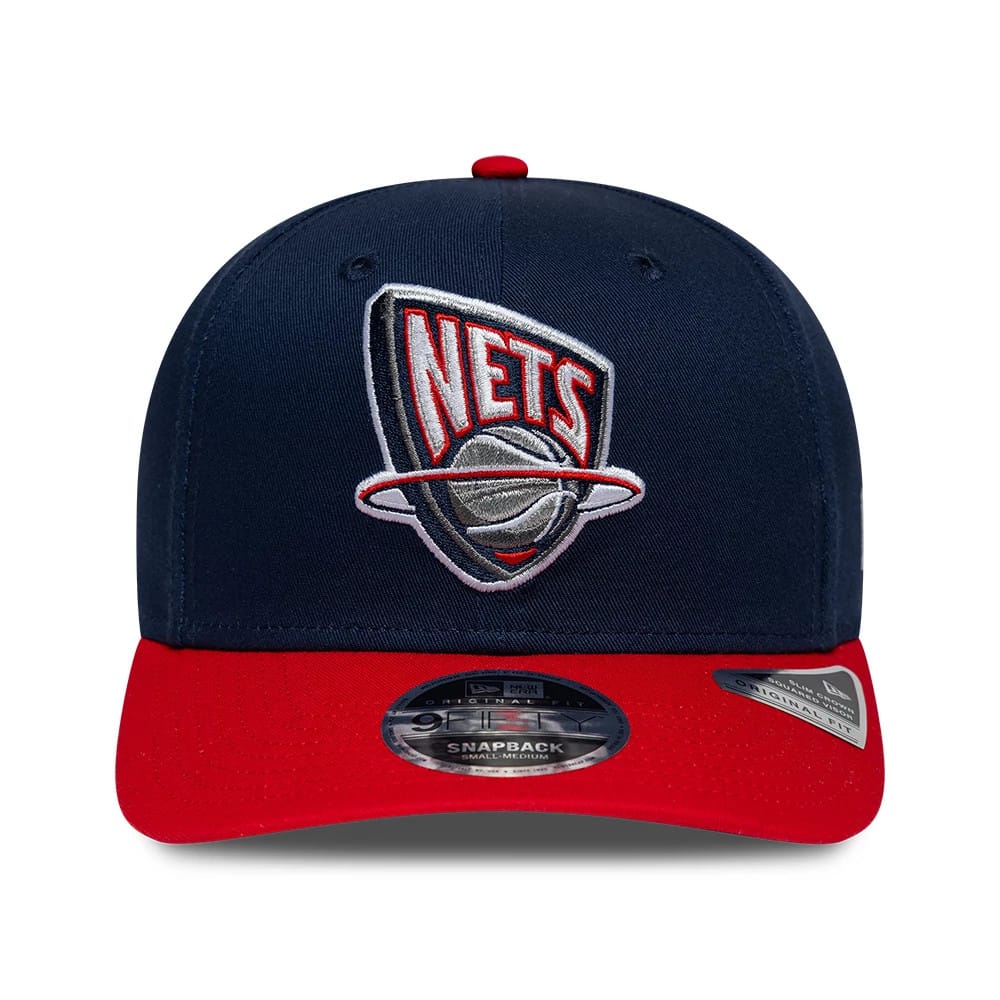 Pictured is this NBA Hardwood Classic New Jersey Nets 9FIFTY Snapback cap in dark blue. 2