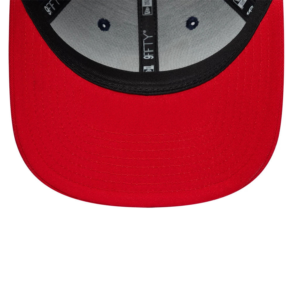 Nets NBA Hardwood Classic Dark Blue New Era 9FIFTY Snapback Adjustable Cap, inside view showing the black sweatband and red undervisor, with silver taping along the interior crown seams and contrasting embroidered eyelets on the grey panels.