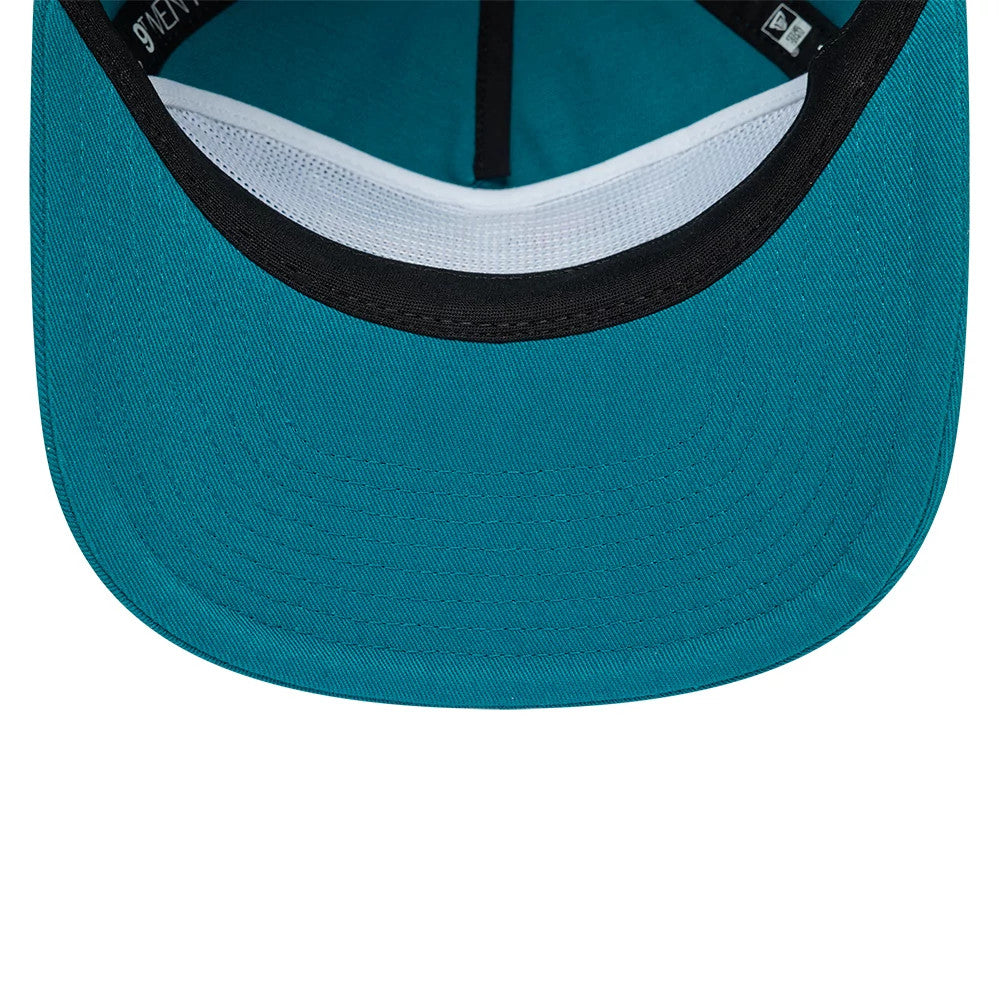 Detroit Pistons NBA Hardwood Classic Turquoise New Era 19TWENTY Adjustable Cap, inside view showing a black sweatband, white mesh taping along the headband, and the same turquoise fabric extending across the undervisor and inner panels.