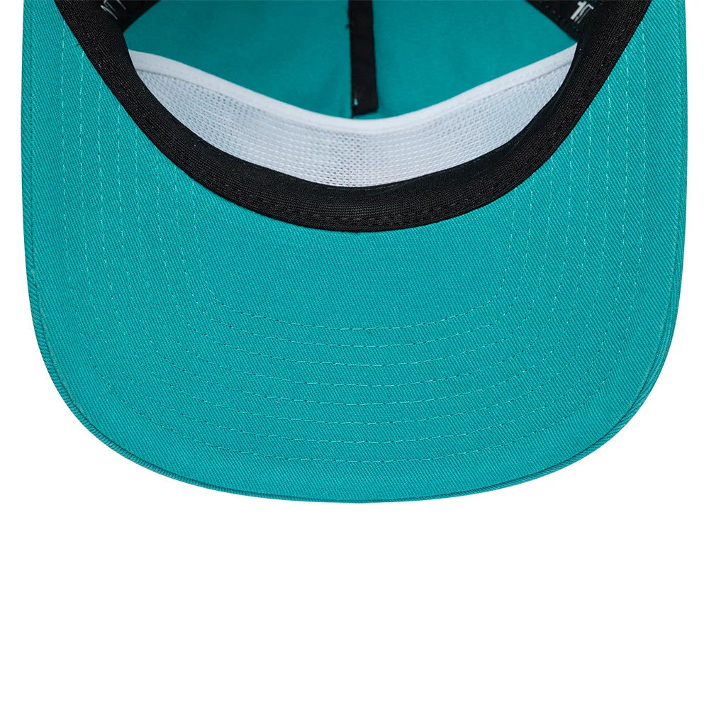 Grizzlies NBA Hardwood Classic Turquoise New Era 19TWENTY Adjustable Cap, inside view showing a turquoise undervisor with white mesh sweatband, accompanied by black taping and a contrasting turquoise interior crown fabric.