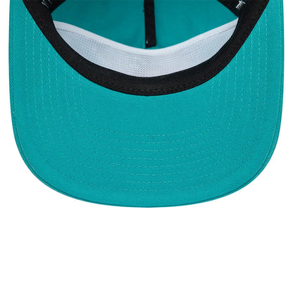 Grizzlies NBA Hardwood Classic Turquoise New Era 19TWENTY Adjustable Cap, inside view showing a turquoise undervisor with white mesh sweatband, accompanied by black taping and a contrasting turquoise interior crown fabric.