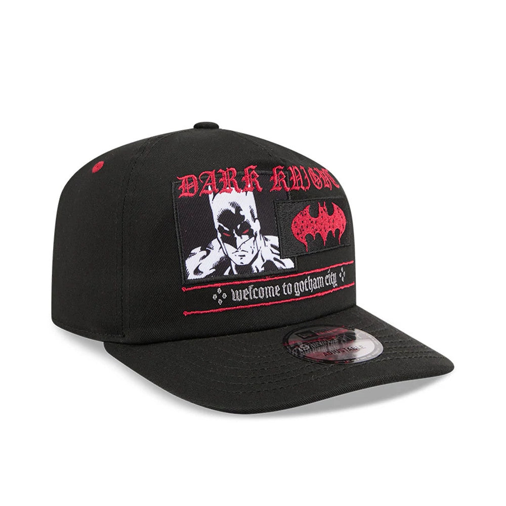 DC Batman Black New Era 19TWENTY Adjustable Cap, front view showing a red embroidered Dark Knight graphic with Batman and bat logo, placed above welcome to gotham city script, and a black curved visor with a New Era size sticker.