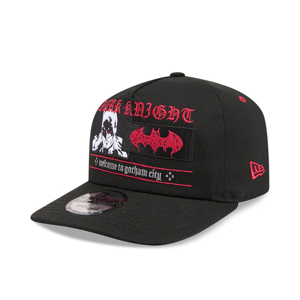 DC Batman Black New Era 19TWENTY Adjustable Cap, front view showing a red embroidered Dark Knight text, Batman graphic on the front panel, and a 19TWENTY size sticker on the black curved visor with a red New Era flag logo on the left side.