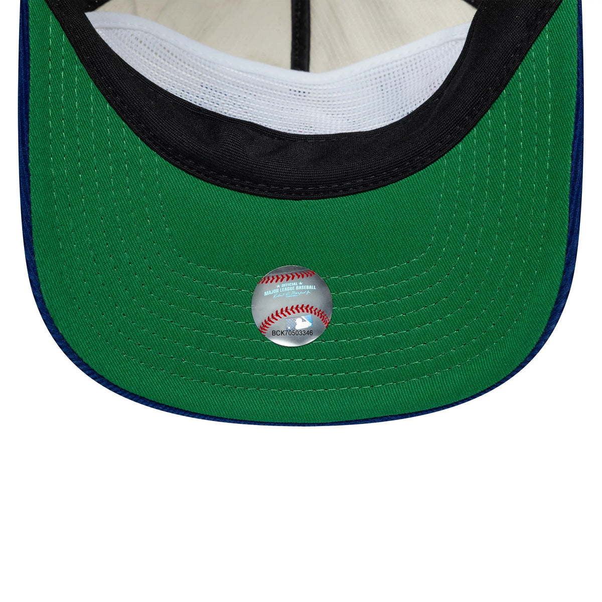 LA Dodgers MLB Retro Dynasty Cord Cream & Blue New Era 19TWENTY Adjustable Cap, inside view showing a green undervisor with a round sticker featuring a baseball design, and a white sweatband surrounding the interior of the structured crown.