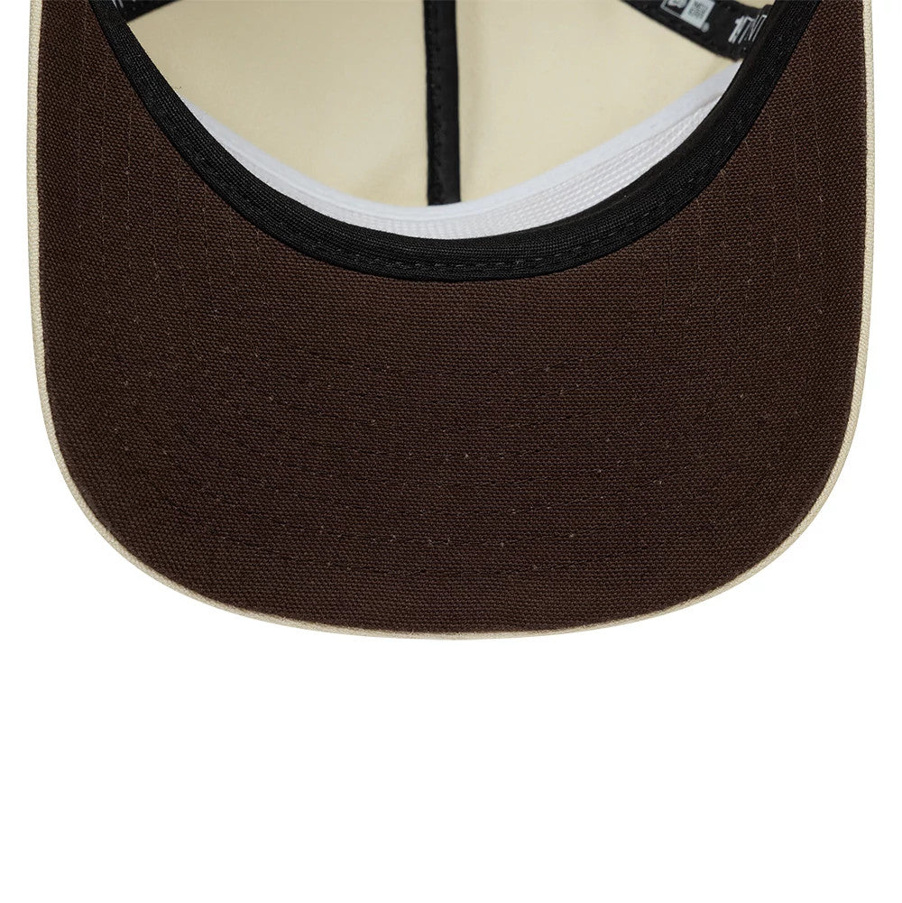 Paramount Yellowstone Light Beige New Era 19TWENTY Adjustable Cap, inside view showing the brown undervisor with a black band, light-toned edge, black seam tape and white sweatband inside the structured crown.