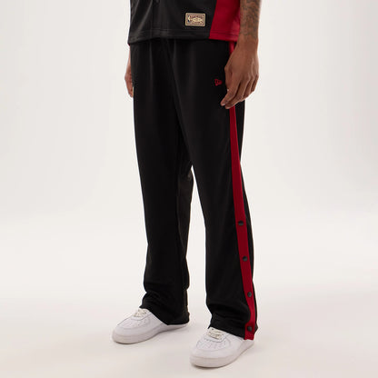 The model is wearing this NBA Hardwood Classic Straight Miami Heat Straight Leg Joggers in black. 3