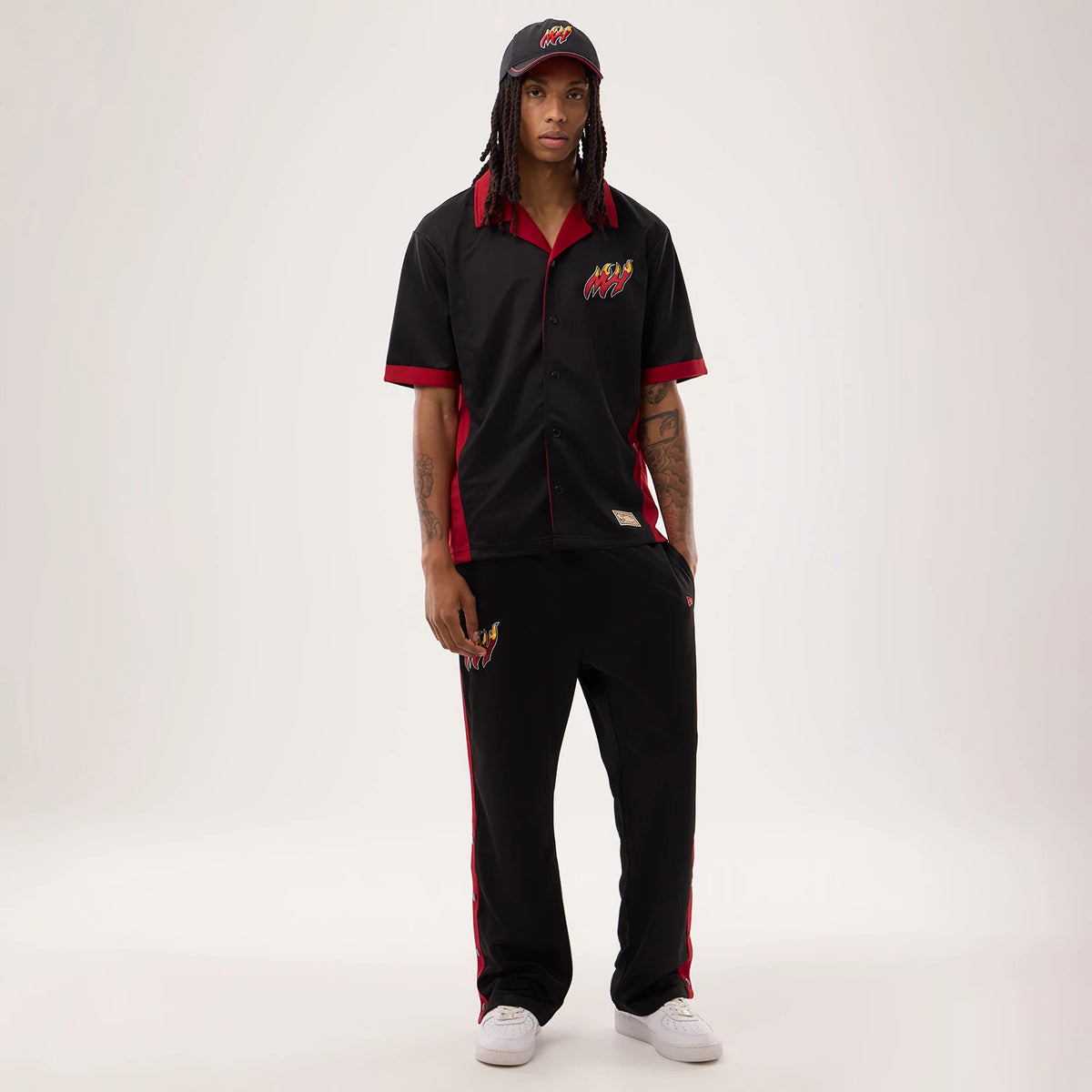 The model is wearing this NBA Hardwood Classic Straight Miami Heat Straight Leg Joggers in black. 8