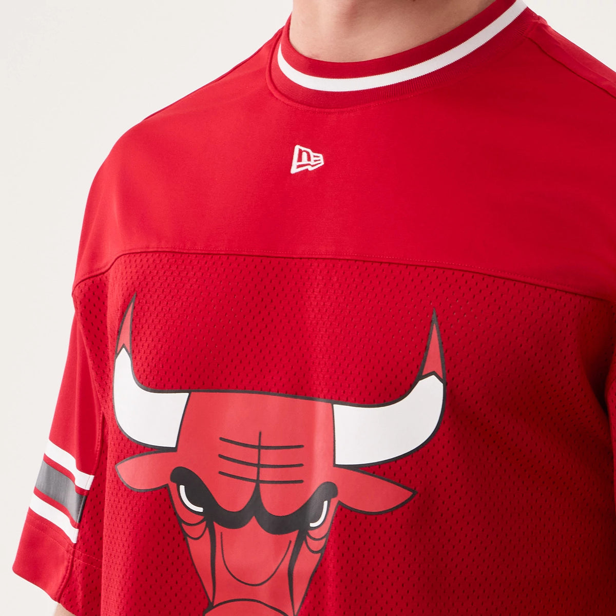New Era Chicago Bulls NBA Hardwood Classic Mesh Oversized Red T-Shirt, front view showing a printed Chicago Bulls bull logo centred on the chest, a white embroidered New Era logo below the collar, and striped on the crew neck.