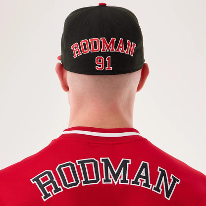 The model is wearing this NBA Hardwood Classic Mesh Oversized Chicago Bulls T-Shirt in red. 6
