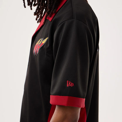 The model is wearing this NBA Hardwood Classic Revere Miami Heat Short Sleeve Shirt in black. 3