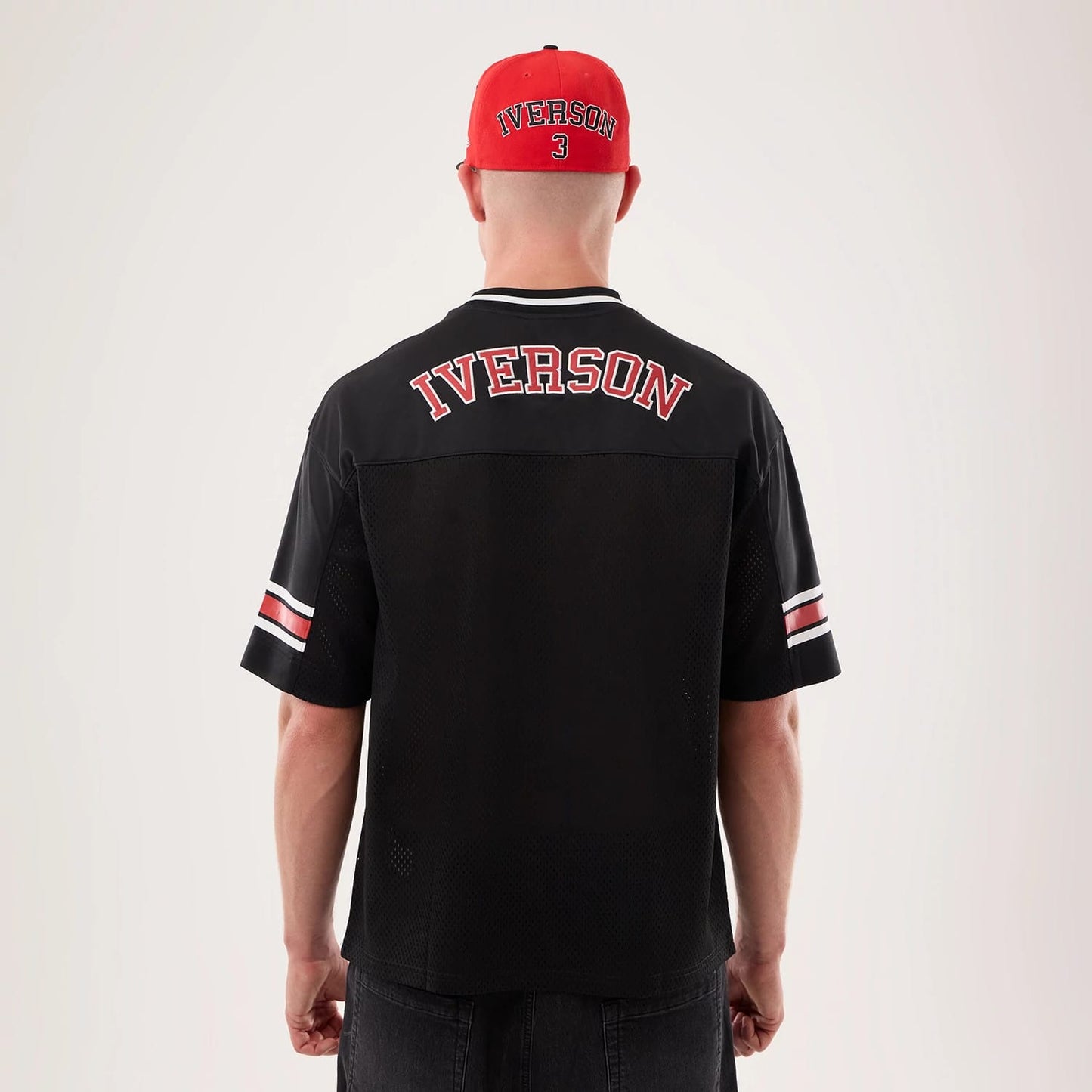 The model is wearing this NBA Hardwood Classic Mesh Oversized Philadelphia 76ers T-Shirt in black. 2