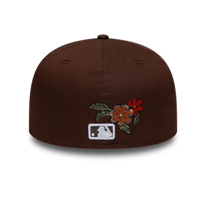 New York Yankees MLB Floral Dark Brown New Era 59FIFTY Fitted Cap, rear view showing the white embroidered MLB Batterman logo at the centre back with floral embroidery featuring red and orange flowers with green leaves on the structured brown crown.