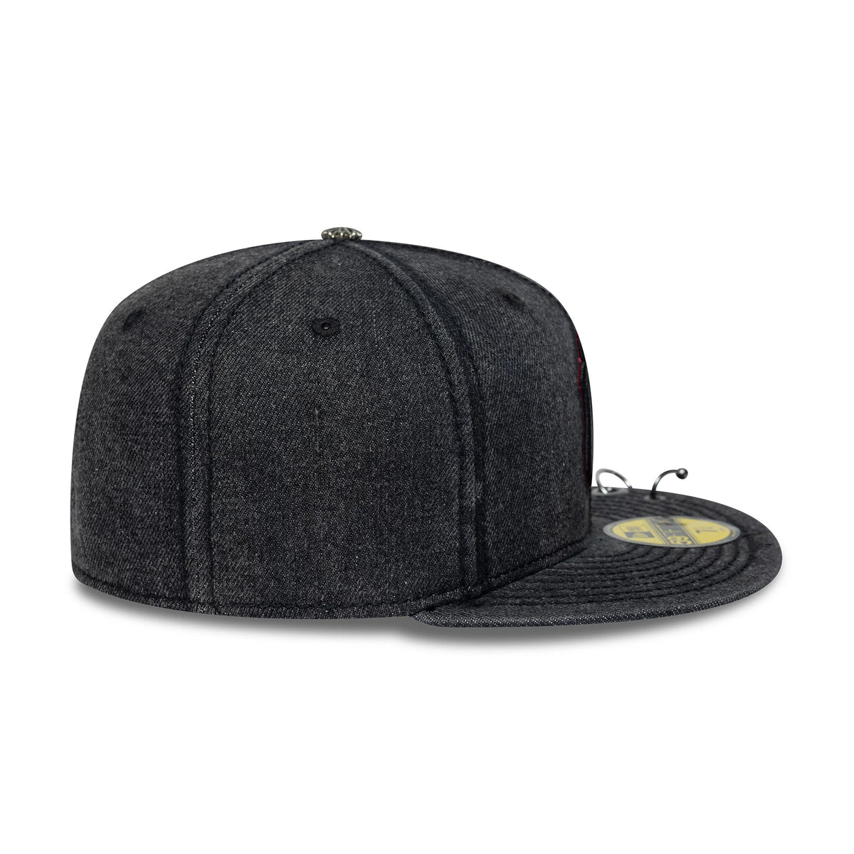 New York Yankees MLB Hardware Washed Black New Era 59FIFTY Fitted Cap, side view showing the raised embroidered New Era flag logo on the left side, a structured washed black crown, and a flat black visor with a gold 59FIFTY size sticker.