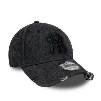 New York Yankees MLB Hardware Black New Era 9FORTY Adjustable Denim Cap, three-quarter view showing the raised black embroidered NY logo on the front panel, a pre-curved denim visor with a 9FORTY size sticker, and distressed on the edge.