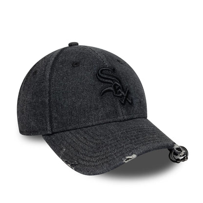 Chicago White Sox MLB Hardware Black New Era 9FORTY Adjustable Denim Cap, three-quarter view showing the black embroidered White Sox logo on the front panel, distressed denim visor, and adjustable strap with buckle at the back.