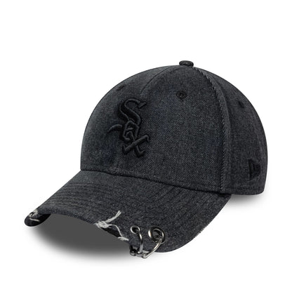 Chicago White Sox MLB Hardware Black New Era 9FORTY Adjustable Denim Cap, three-quarter view showing a black embroidered front logo on a distressed denim crown, with rings on the frayed black visor and the New Era flag logo on the left side.