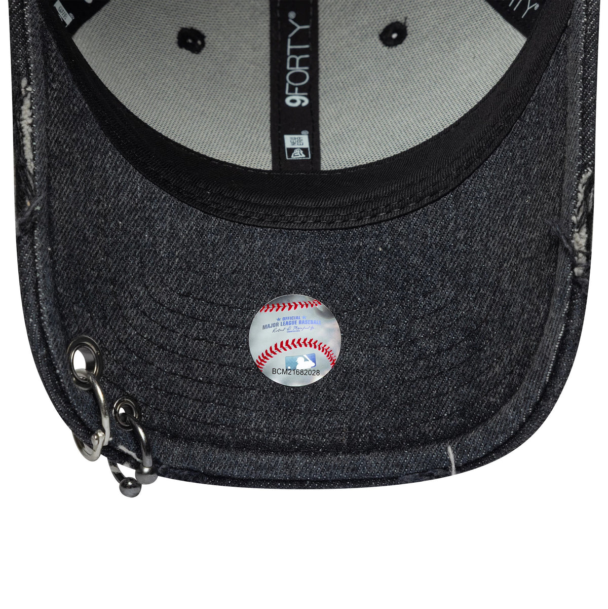 Chicago White Sox MLB Hardware Black New Era 9FORTY Adjustable Denim Cap, inside view showing a black sweatband, grey undervisor, and New Era taping, with a unique silver grommet and chain on the denim visor.