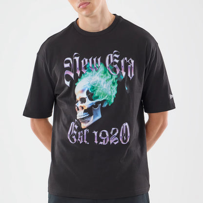 The model is wearing this New Era Skull Graphic Oversized T-Shirt in black. 3