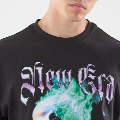 The model is wearing this New Era Skull Graphic Oversized T-Shirt in black. 4